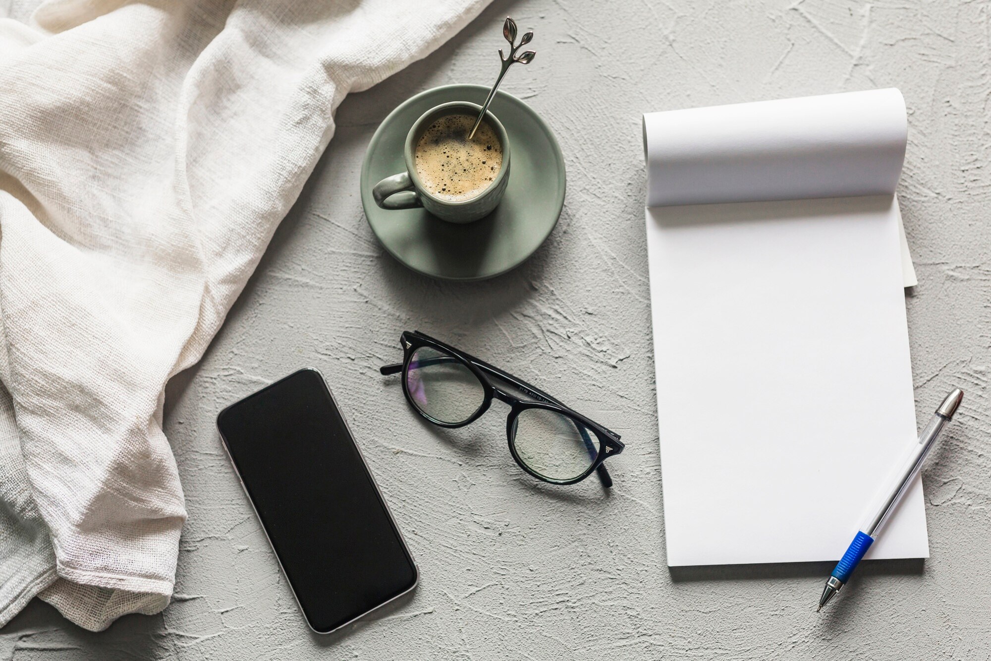 Notebook and calm desk setting used for planning a weekly routine
