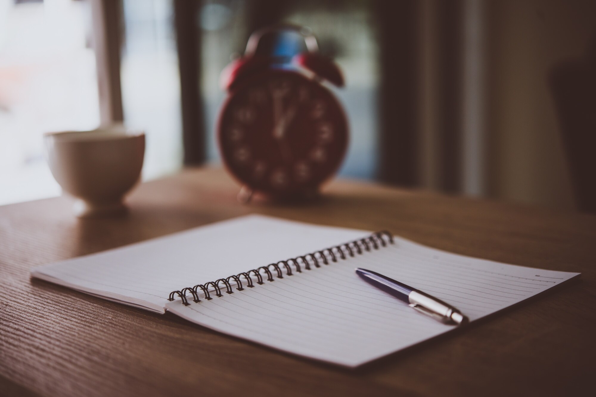 Quiet writing desk with a notebook and pen